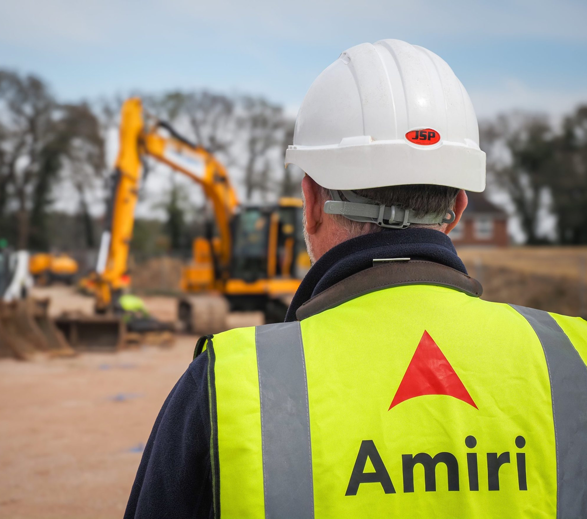 Person on construction site wearing Amiri branded high-vis