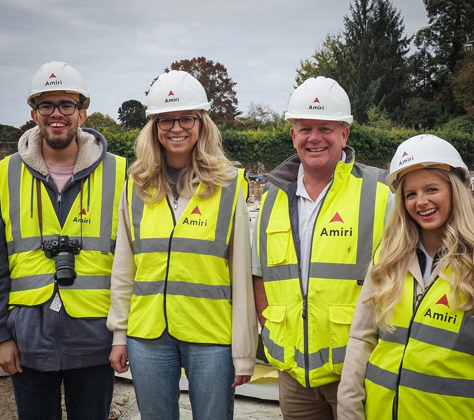 Employees wearing branded Amiri high-vis and helmets