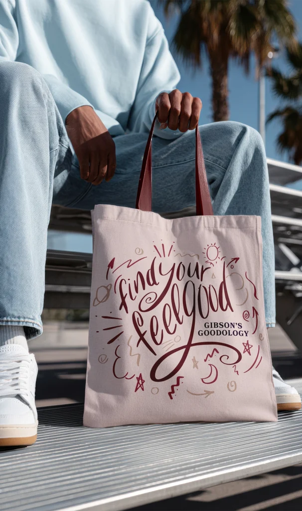 A person holding a Gibsons Goodology 'Find your feelgood' tote bag