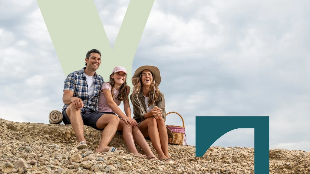 Family on beac with Bargate brand identity around them