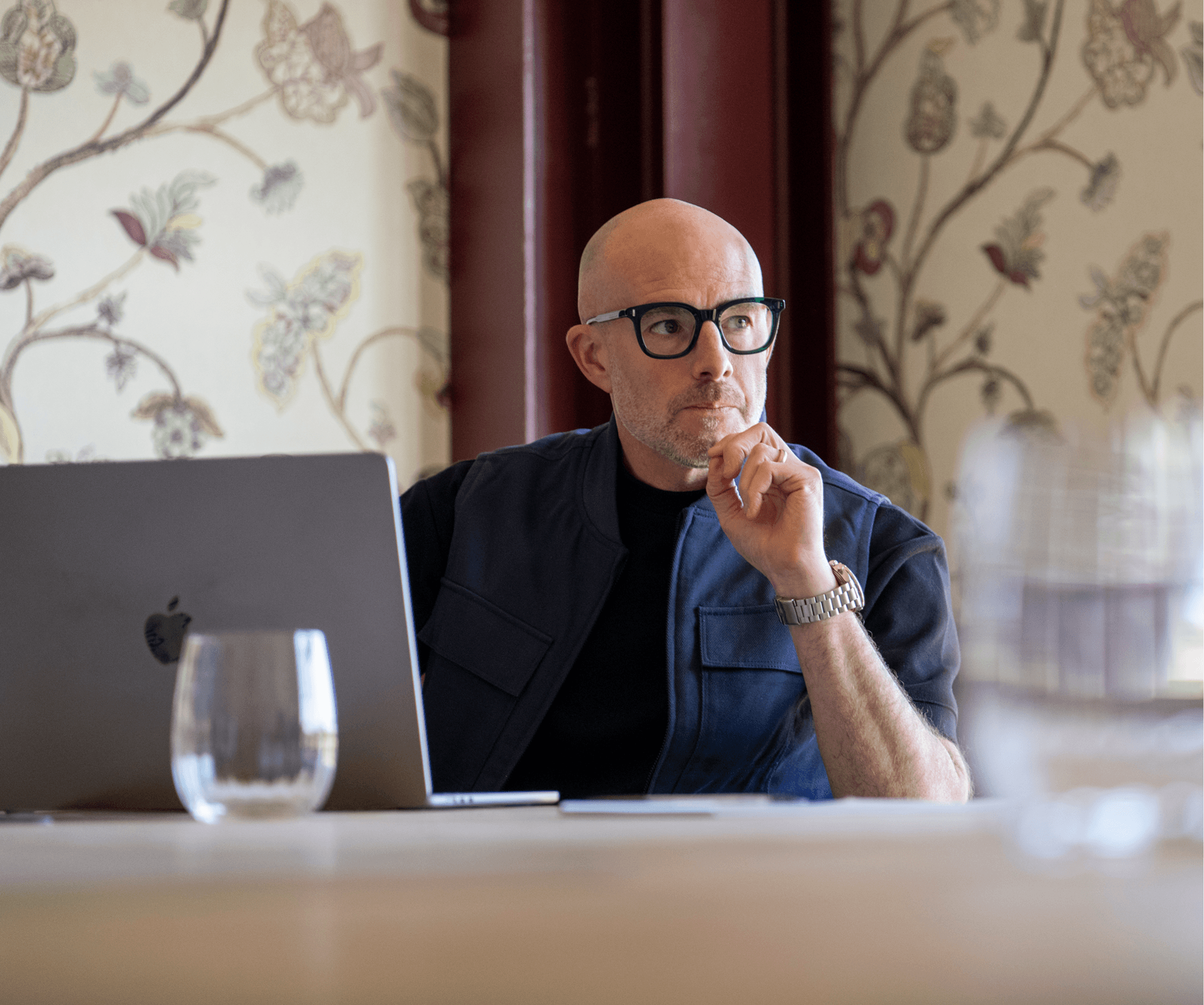 Ian contemplating in a meeting